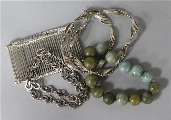 A stylish silver bracelet, two silver necklaces and a hardstone bracelet.
